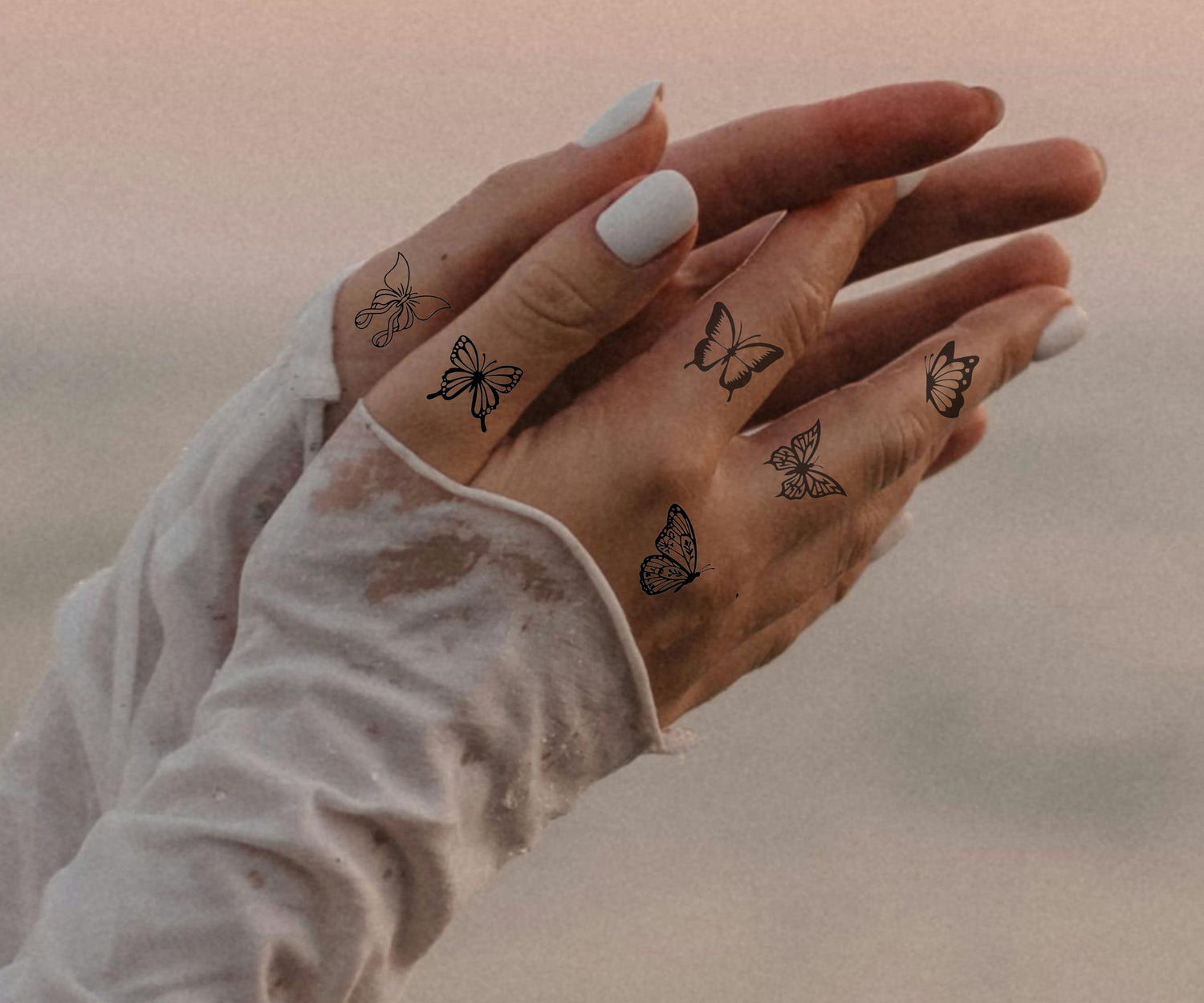 Schmetterling Finger Tattoos