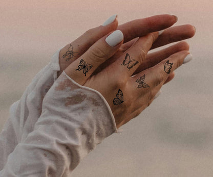 Schmetterling Finger Tattoos
